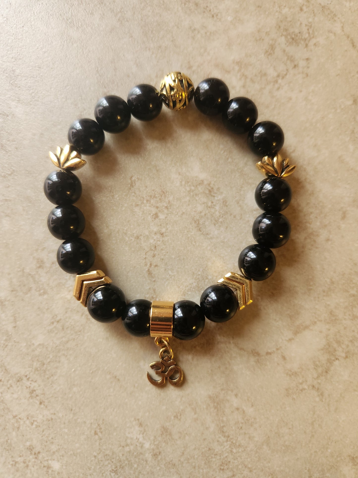 Gold Ohm charm bracelet